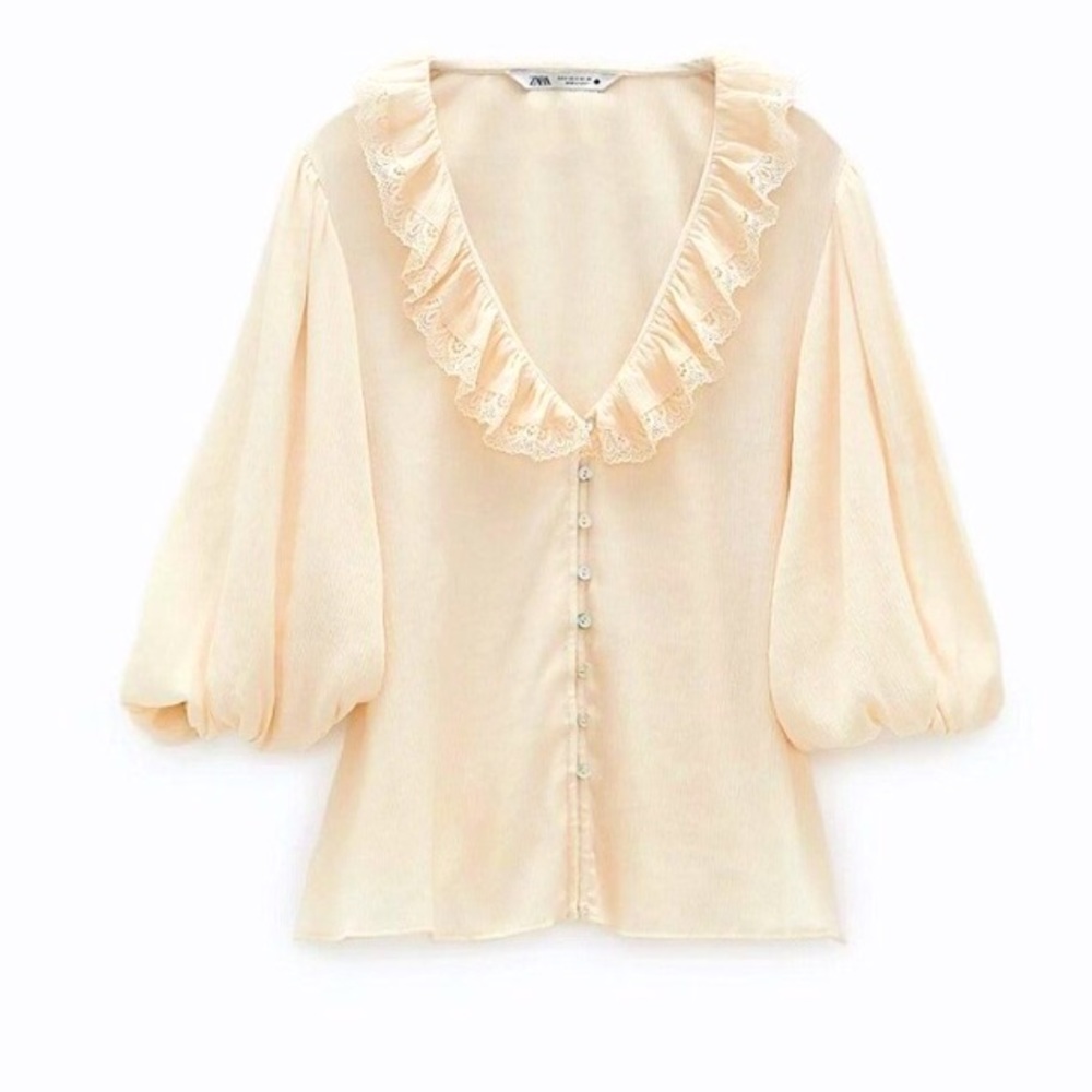 Zara’s ruffled lace blouse